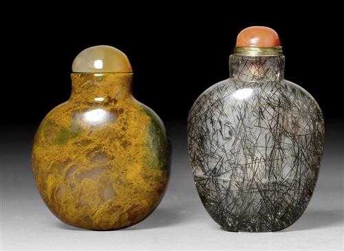 Appraisal: THREE SNUFF BOTTLES China th century a Quarz ovoid bottle