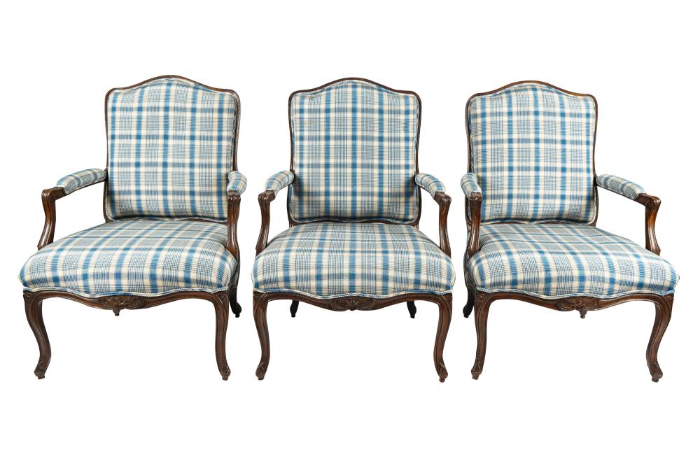 Appraisal: THREE PROVINCIAL LOUIS XV-STYLE CARVED WOOD FAUTEUILScovered in blue and