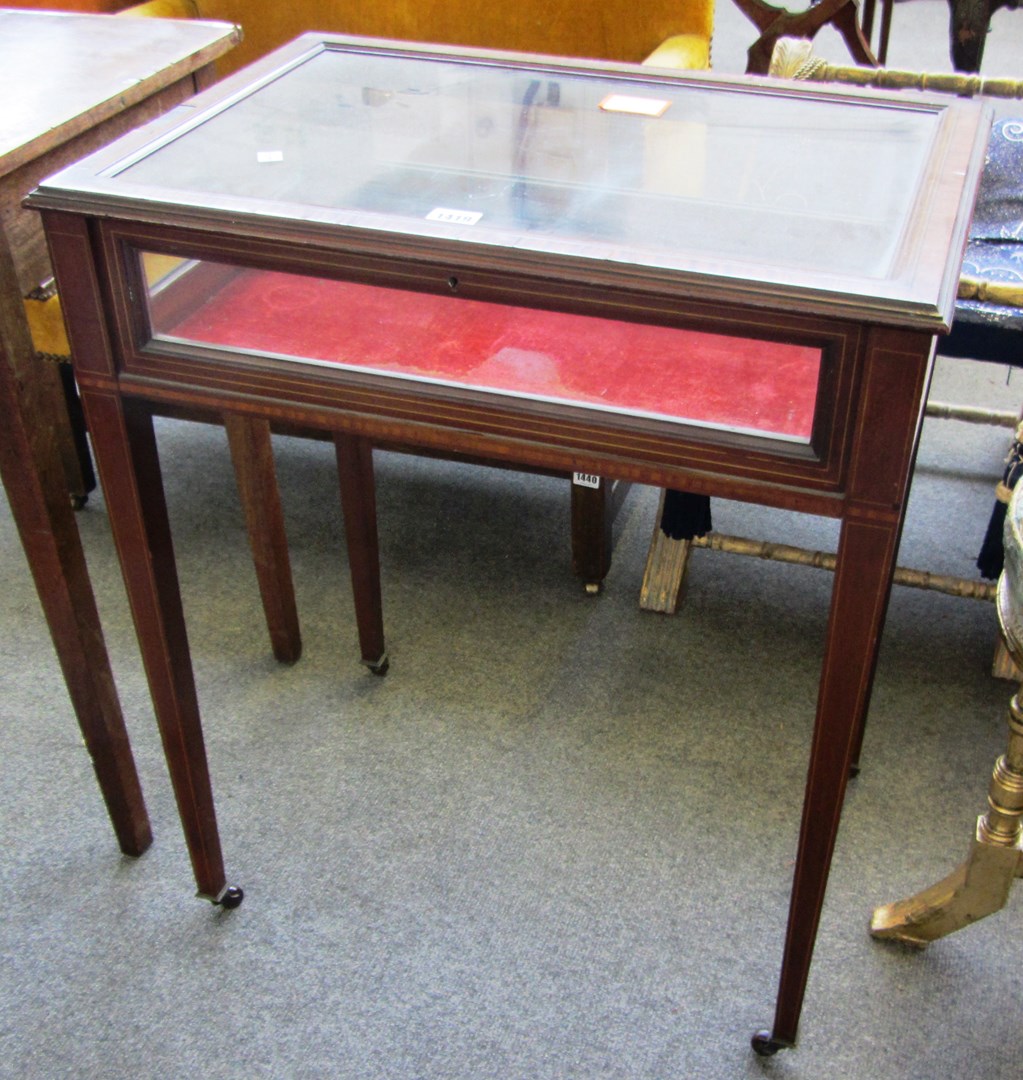 Appraisal: An Edwardian satinwood banded rectangular mahogany bijouterie table on tapering