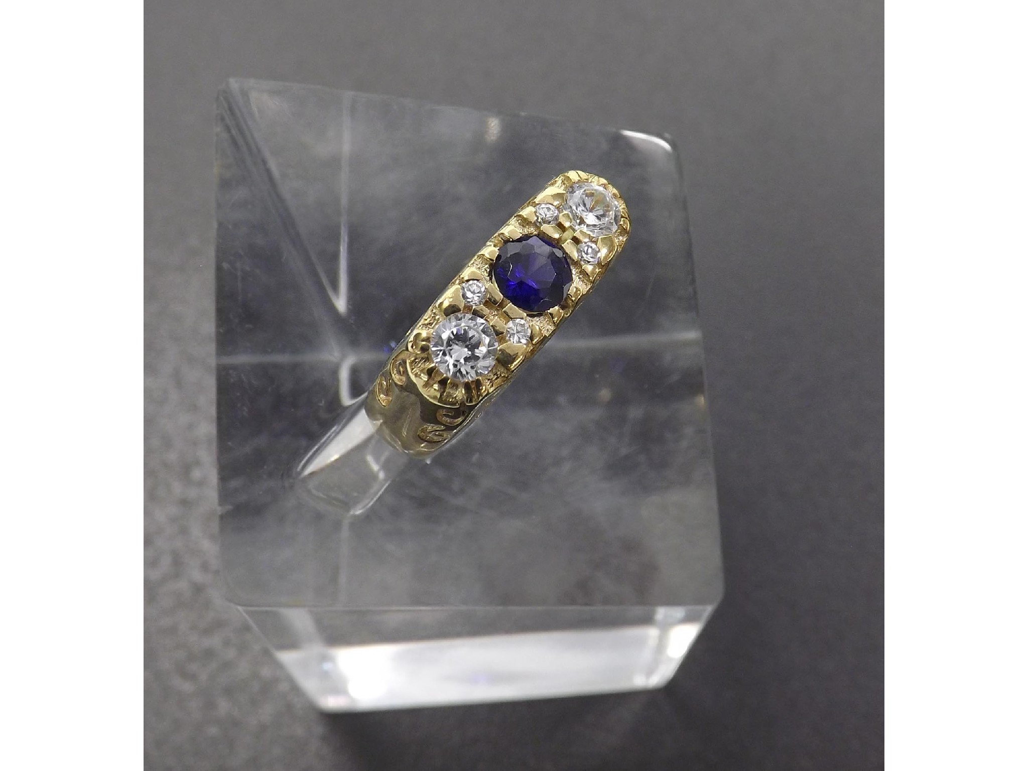 Appraisal: GNNNB ct synthetic sapphire and cz yellow gold dress ring