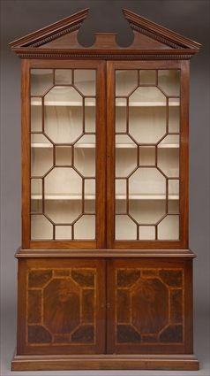 Appraisal: GEORGE III-STYLE INLAID MAHOGANY BOOKCASE CABINET The breakarch crest with