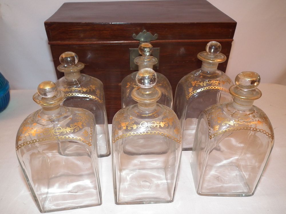 Appraisal: EARLY CASED GLASS DECANTER SET Circa decanter set in fitted