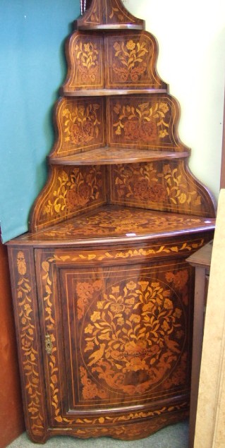 Appraisal: A Dutch walnut and floral marquetry corner cabinet th century