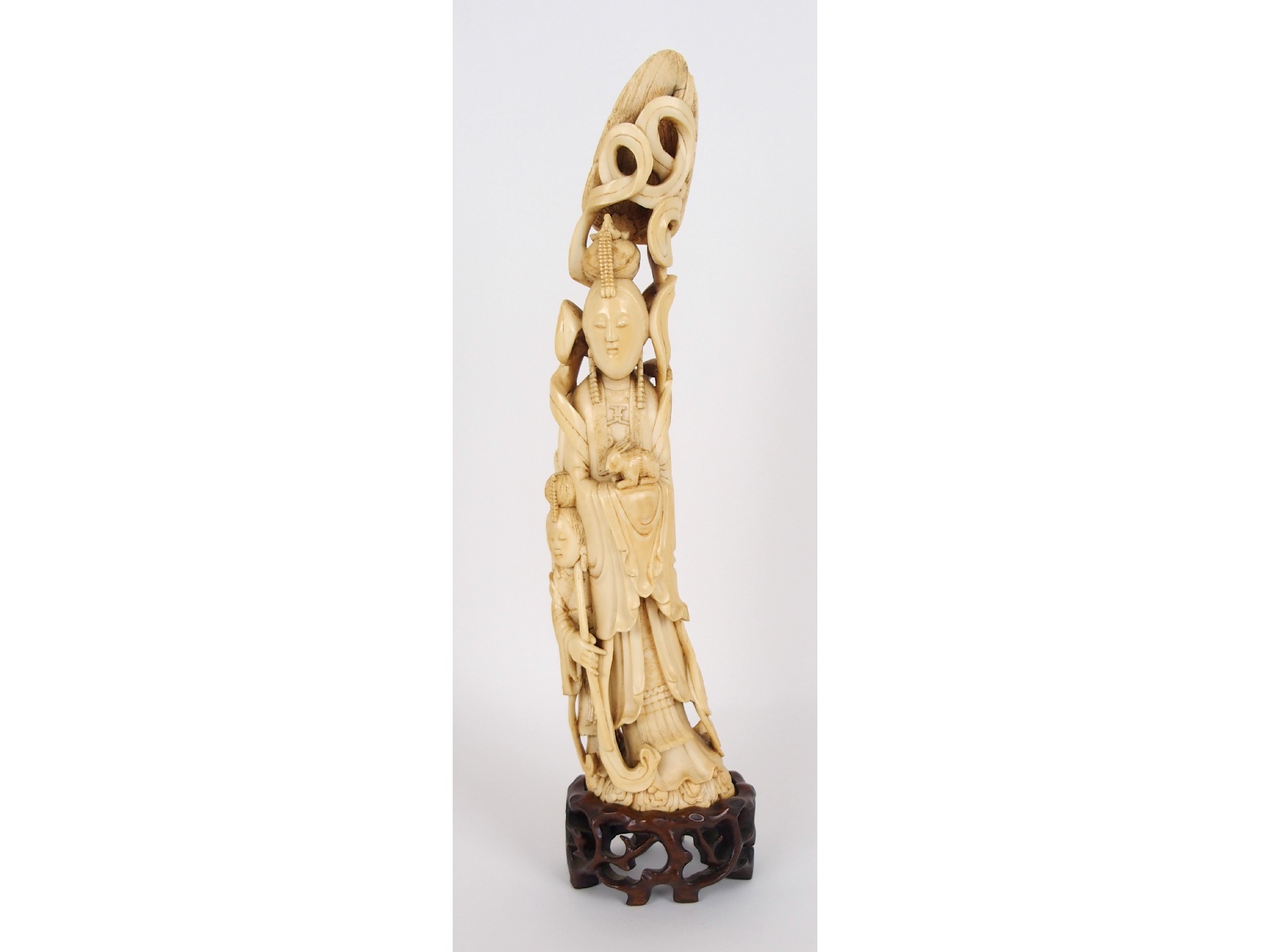 Appraisal: A Chinese carved ivory tusk figure of an immortalholding a