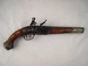 Appraisal: A Turkish flintlock pistol with silver muzzle sleeve embossed and