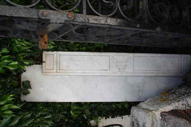 Appraisal: A TH CENTURY CARRARA MARBLE FIRE SURROUND with carved classical