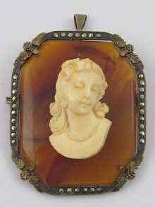 Appraisal: An ivory cameo mounted on agate set in a white