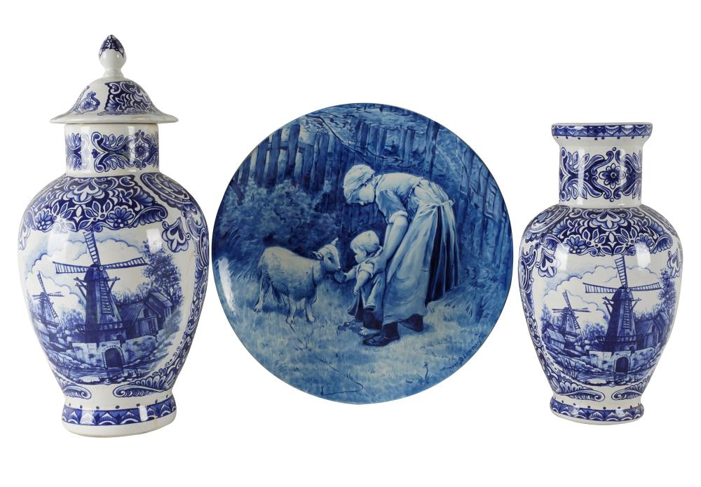 Appraisal: THREE DELFT PORCELAIN ARTICLEScomprising a charger hand-painted mark urn F