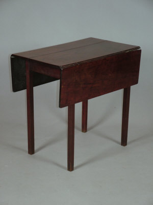 Appraisal: A George III mahogany pembroke table upon square legs x