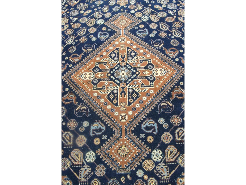 Appraisal: A Turkish style carpet decorated with medallions on a multi-coloured