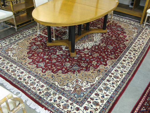 Appraisal: HAND KNOTTED ORIENTAL CARPET Pakistani-Persian floral and central floral medallion