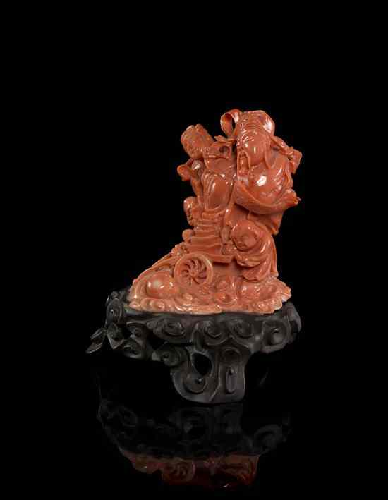 Appraisal: A Chinese Coral Carving depicting a man woman and three