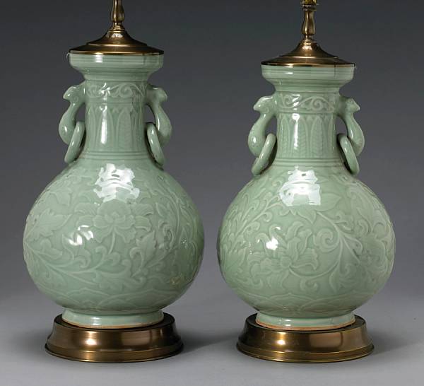 Appraisal: A pair of celadon glazed porcelain bottle vases Each applied