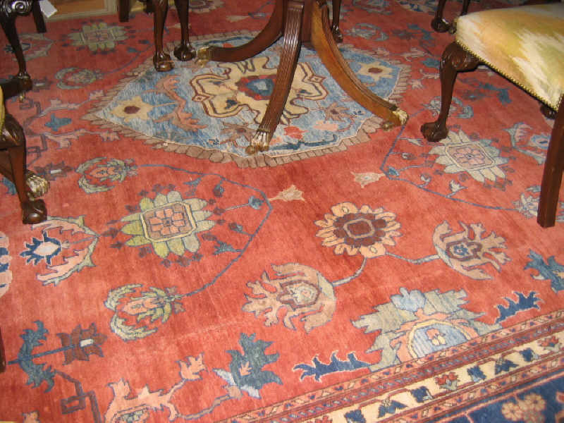 Appraisal: SERAPI DESIGN PALACE CARPET With floral medallions throughout the open