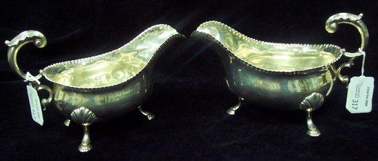 Appraisal: A pair of George III sauceboats with fluted rims and