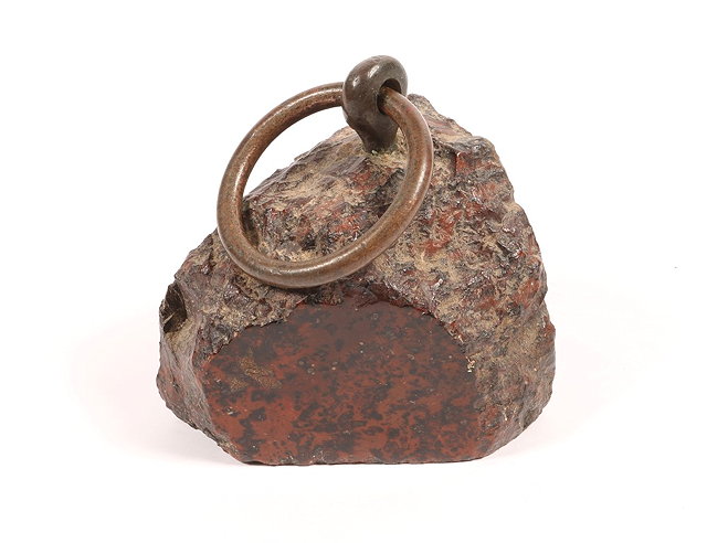 Appraisal: AN TH CENTURY COUNTRY HOUSE VOLCANIC ROCK DOOR STOP with