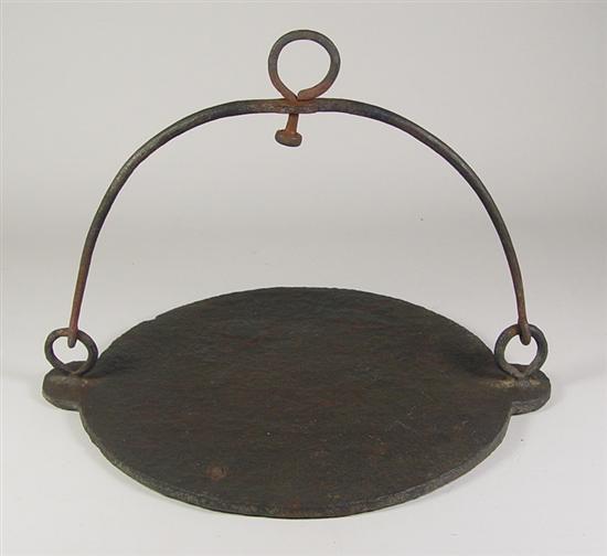 Appraisal: Hand Wrought Fireplace Griddle Blacksmith made bail and hanging eye