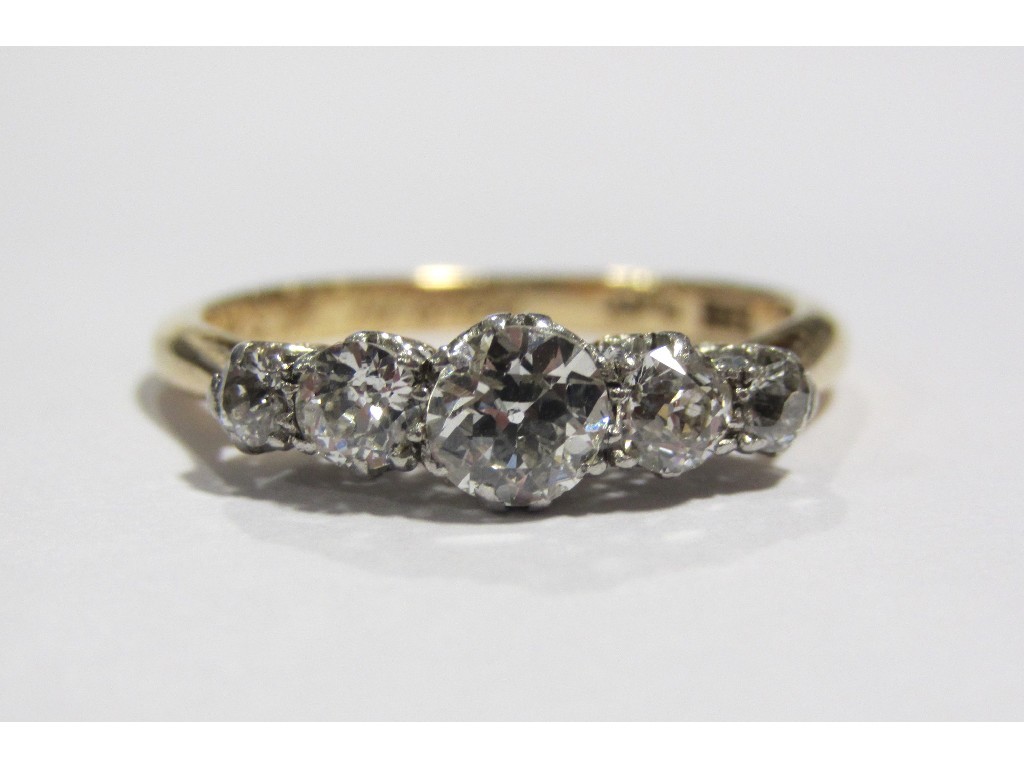 Appraisal: An Edwardian ct gold and platinum diamond five stone ring