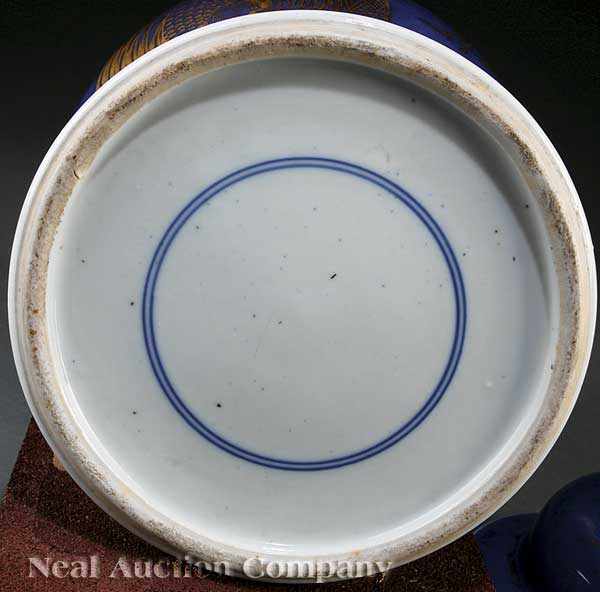 Appraisal: A Near Pair of Chinese Gilt Decorated Powder Blue Porcelain