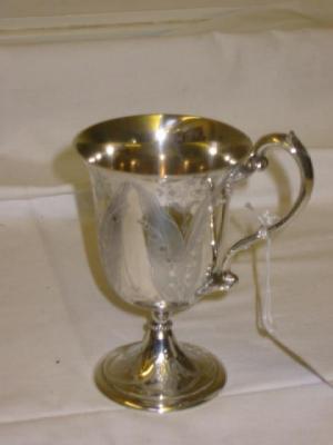 Appraisal: A VICTORIAN GOBLET with loop handle on leaf terminals flared