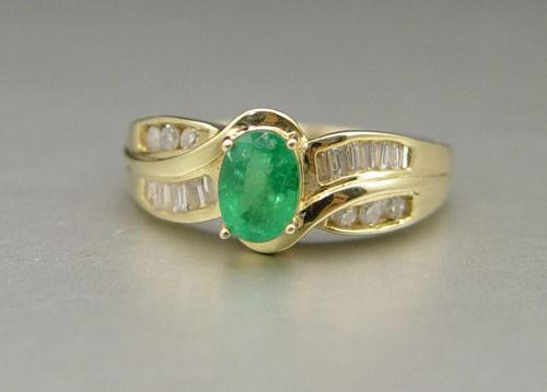 Appraisal: K EMERALD AND DIAMOND RING K yellow gold ring contains