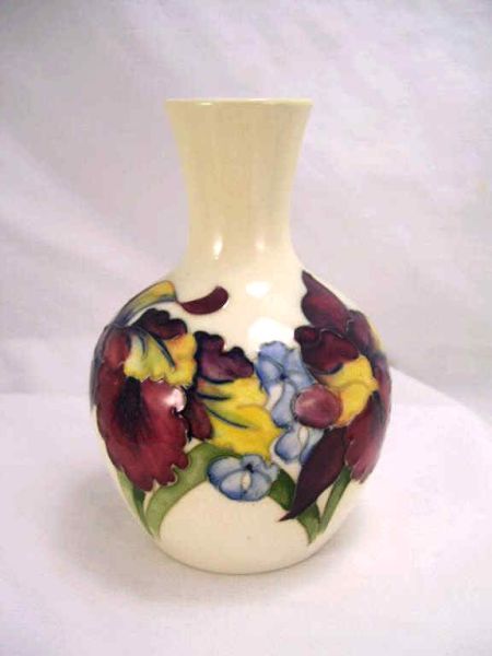 Appraisal: Moorcroft Pottery Vase Bottle neck vase with Iris design Measures