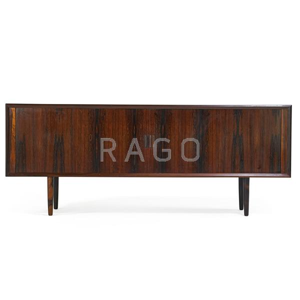 Appraisal: IB KOFOD-LARSEN Rosewood tambour desk Condition Report Two sliding tambour