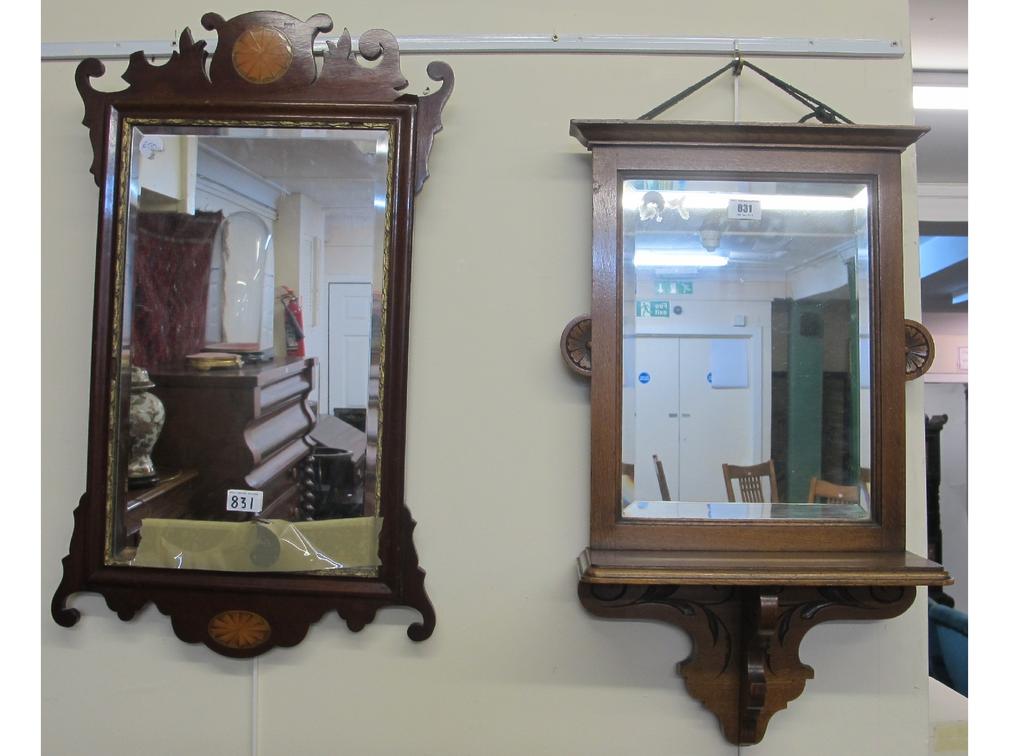 Appraisal: An inlaid Georgian style mahogany wall mirror and an oak