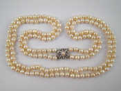 Appraisal: A two row cultured pearl necklace with a white metal