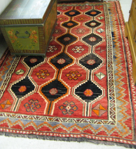 Appraisal: PERSIAN SHIRAZ CARPET overall repeating hexagonal panel type in red