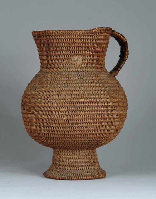 Appraisal: APACHE INDIAN HANDLED BASKET Pitcher form with pedestal base round