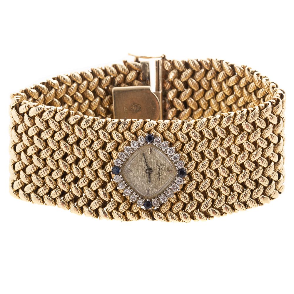 Appraisal: A Wide Textured Bracelet with Watch in K K yellow