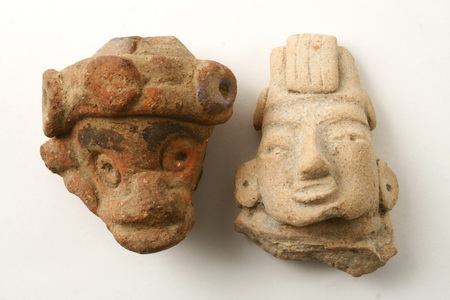 Appraisal: PRE-COLUMBIAN CLAY FRAGMENTS - Heads of Tlaloc tall and Cihuateotl