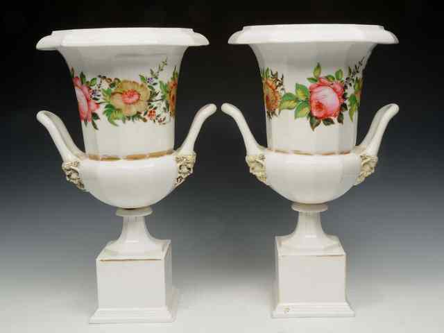 Appraisal: A PAIR OF FRENCH PORCELAIN URNS OF CAMPAGNA FORM decorated