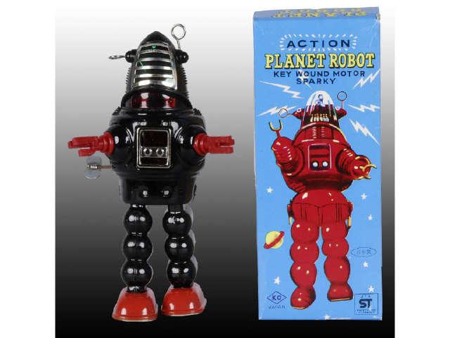 Appraisal: Japanese Wind-Up Planet Robot Toy with Box Description Tin with