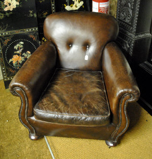 Appraisal: A vintage French brown leather upholstered armchair