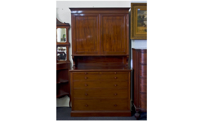 Appraisal: Mahogany Bookcase On Chest Two Doors Enclosing A Fitted Interior