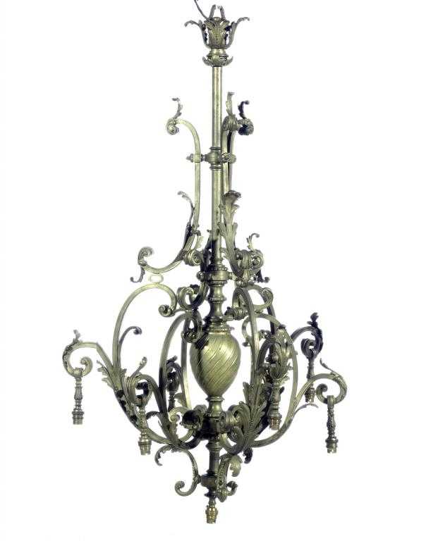 Appraisal: A BRONZE CHANDELIER of six lights on leafy scrolling bifurcated