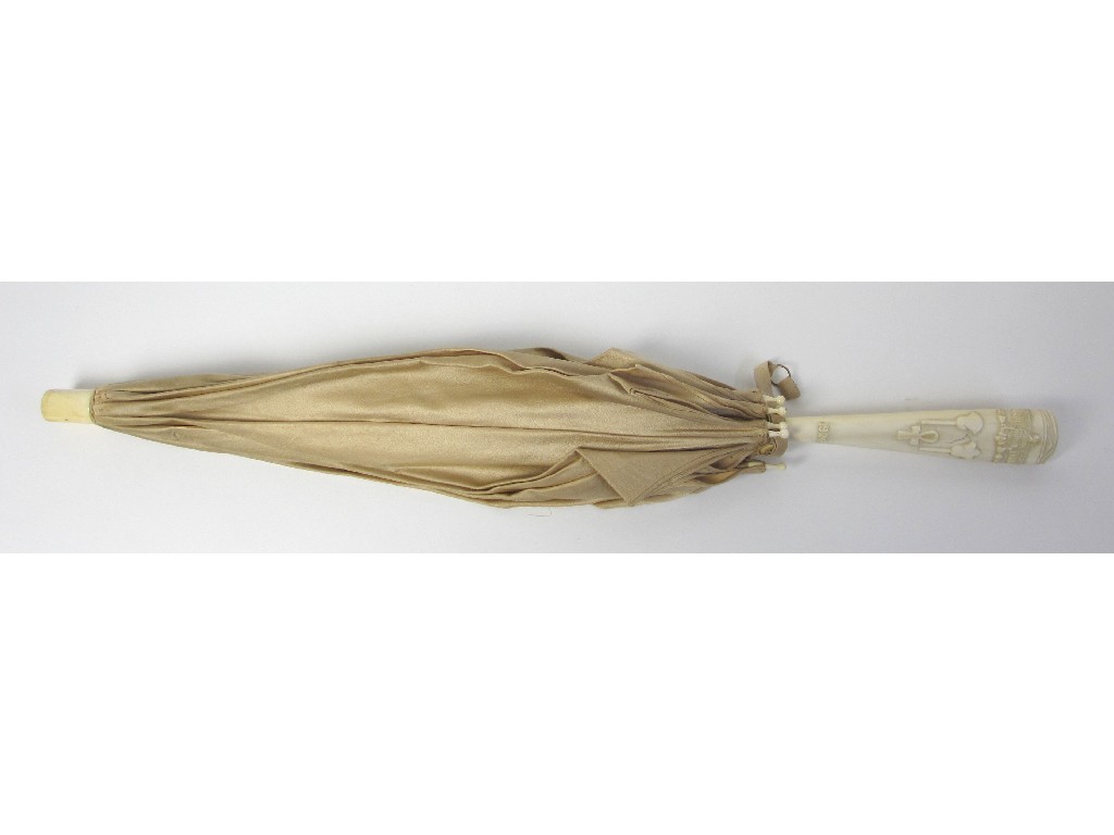 Appraisal: An ivory mounted parasol the handle carved with Egyptian motifs