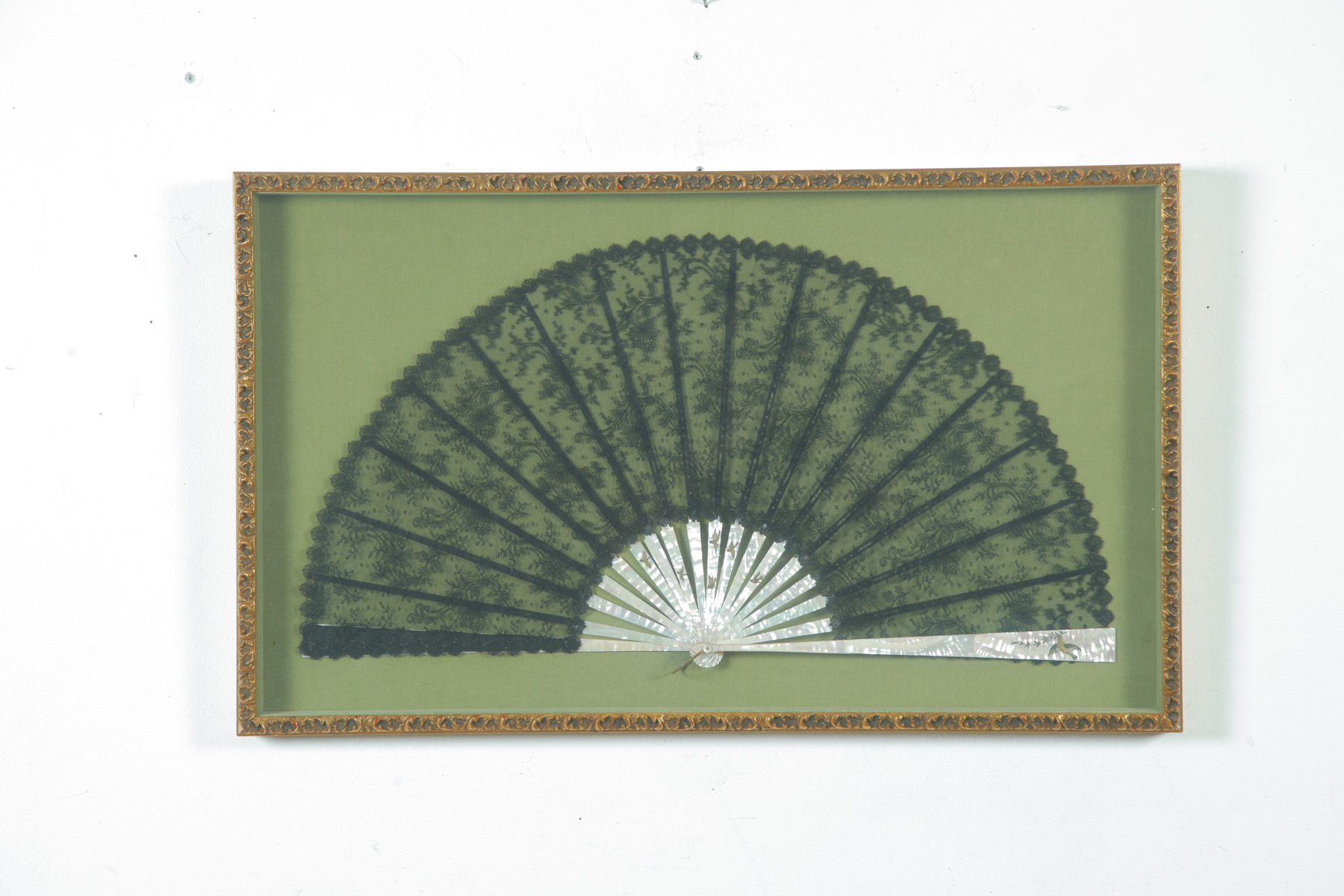 Appraisal: FRAMED BLACK LACE FAN European ca Intricately woven lace with