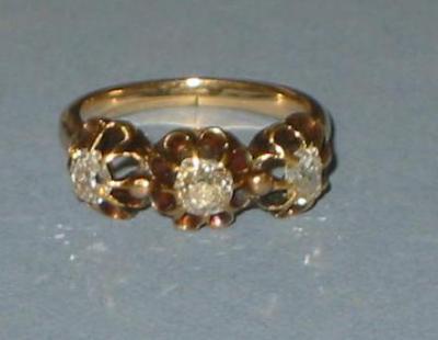 Appraisal: A VICTORIAN THREE STONE DIAMOND RING the cushion cut stones