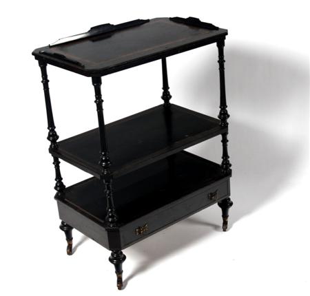 Appraisal: A Victorian ebonised whatnot with three crossbanded open shelves with