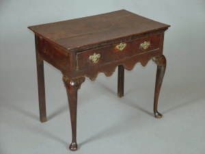 Appraisal: An early George III oak lowboy the two plank top