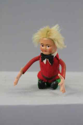 Appraisal: SCHUCO GYMNASTIC TUMBLER Germany depicted with full blonde hair felt