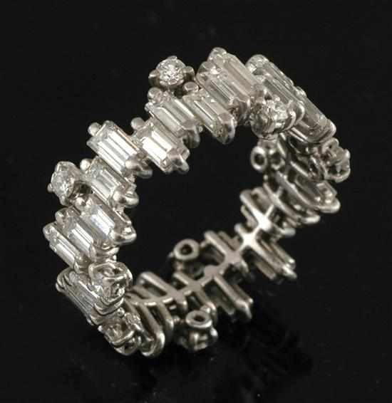 Appraisal: A diamond eternity ring The abstract style full circle set