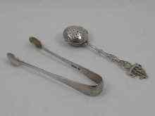 Appraisal: An standard silver tea infuser approx cm long together with