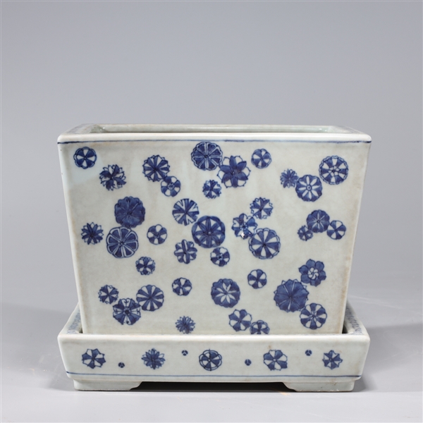 Appraisal: Chinese blue and white porcelain planter with stand floral designs