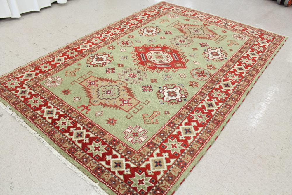 Appraisal: HAND KNOTTED ORIENTAL CARPET Indo-Persian tribal having three geometric medallions