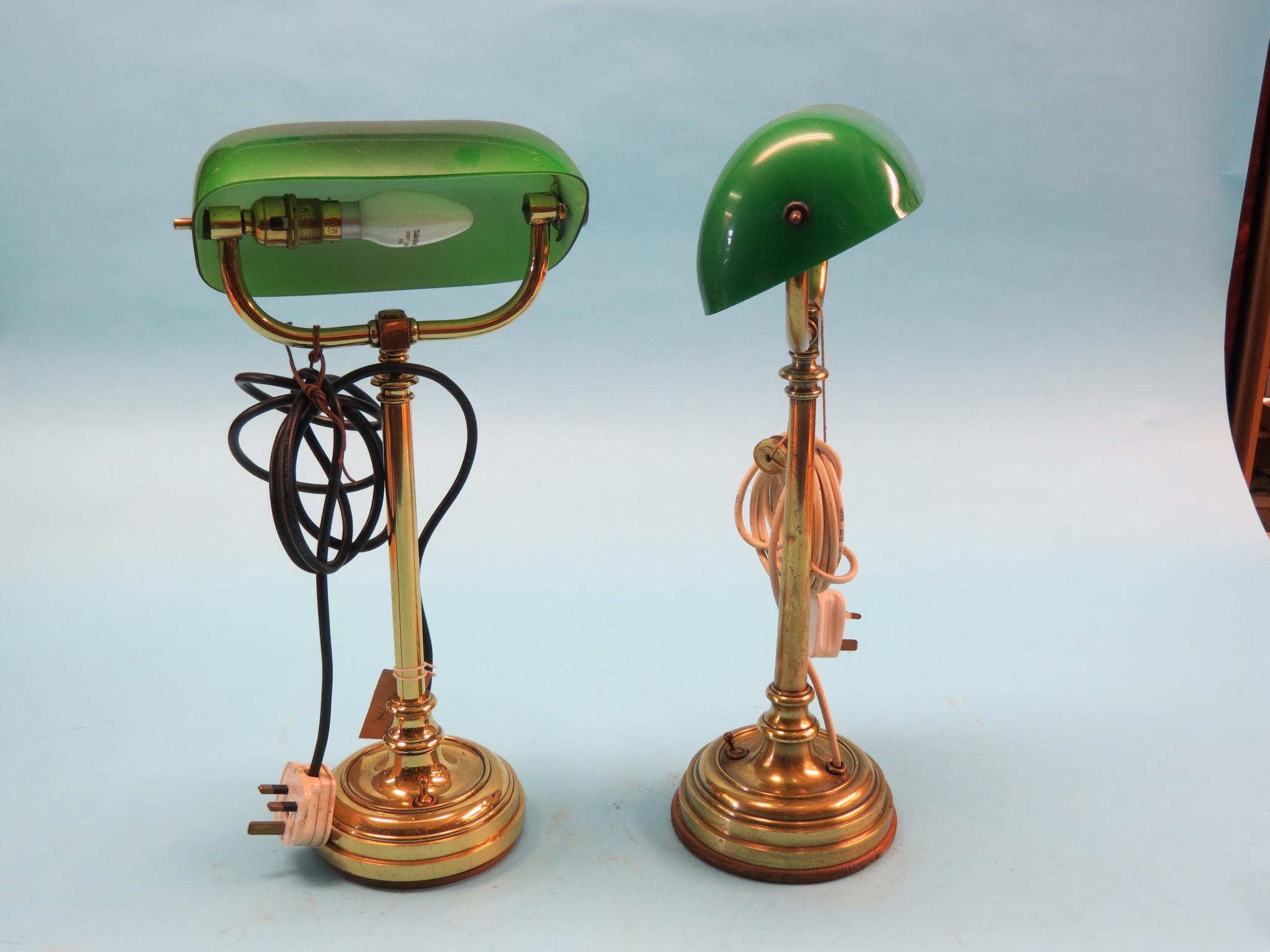 Appraisal: A pair of Edwardian brass anglepoise desk lamps tubular brass