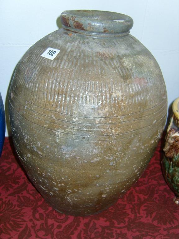 Appraisal: A brown glazed studio pottery vase of ovoid form with